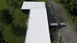 a commercial roof that recently underwent a rubber roof coating