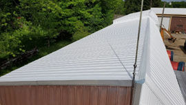 a commercial roof that recently underwent a urethane modified acrylic coating